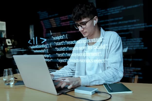 A man does programming on a laptop