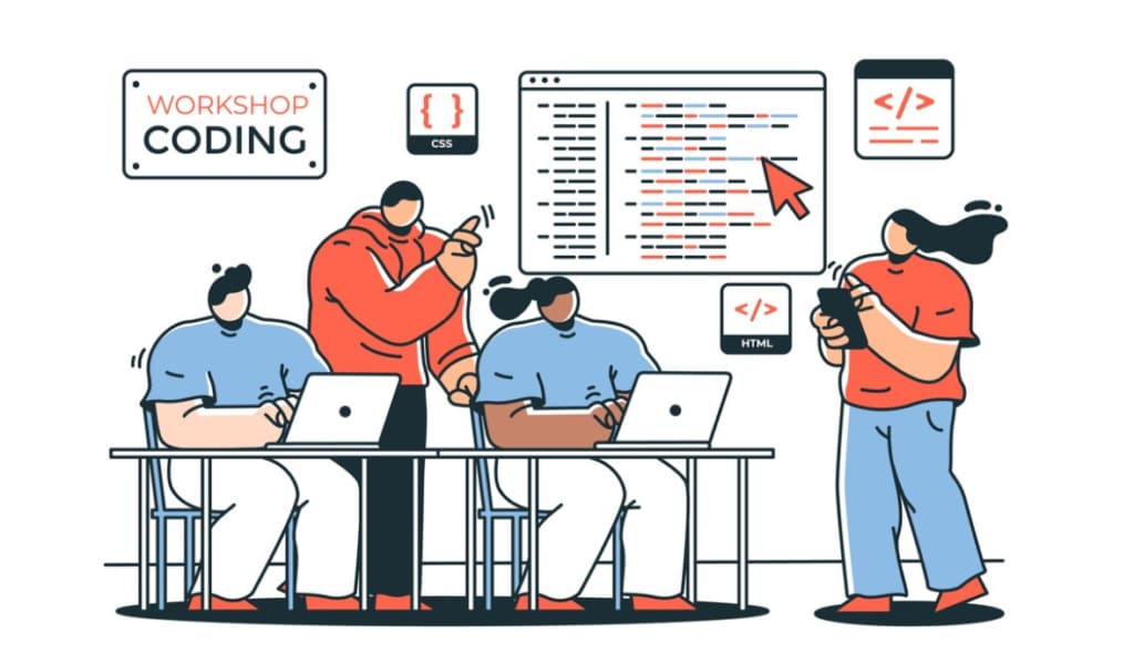 Alt: people sitting at the table and typing on the laptops, two standing near them, coding signs above