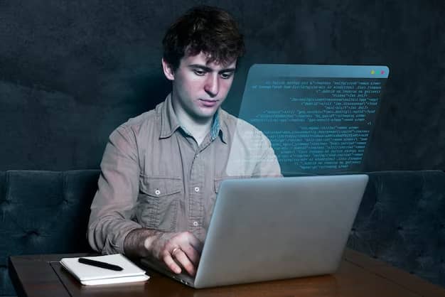A guy is programming on a computer with a notep