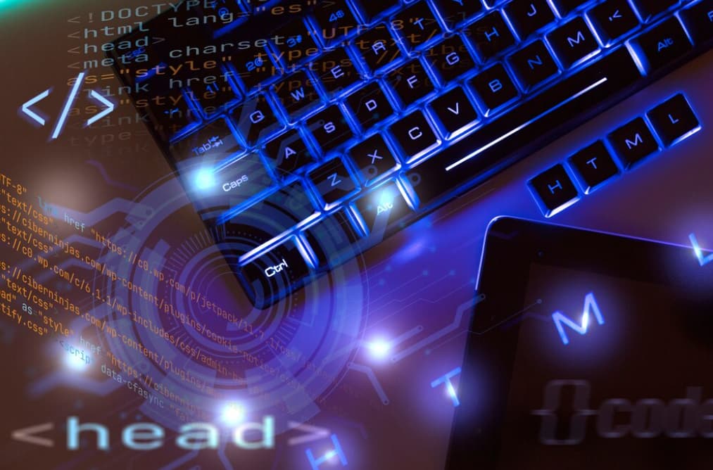 Blue backlit keyboard overlaid with HTML code graphics